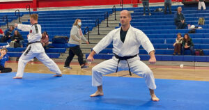 Adam Bockler competes in forms at a martial arts tournament