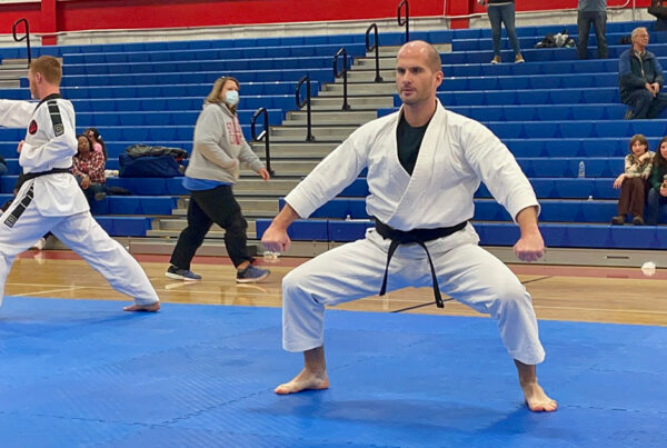 Adam Bockler competes in forms at a martial arts tournament