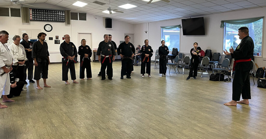 Hanshi James Gifford teaches participants at a martial arts seminar in Ridge Manor, Florida