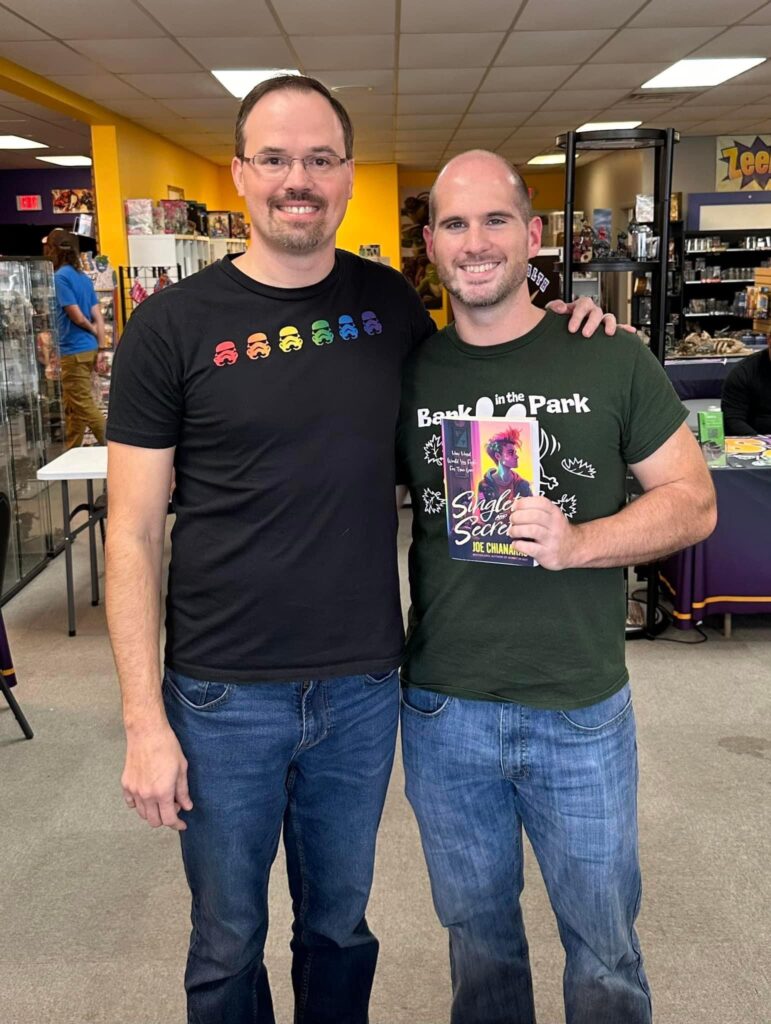 Joe Chianakas and Adam Bockler pose for a photo during a Singlets and Secrets book signing