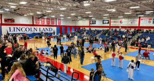 The tournament floor at the 2024 Bill Auvenshine Memorial filled with athletes, coaches, and supporters.